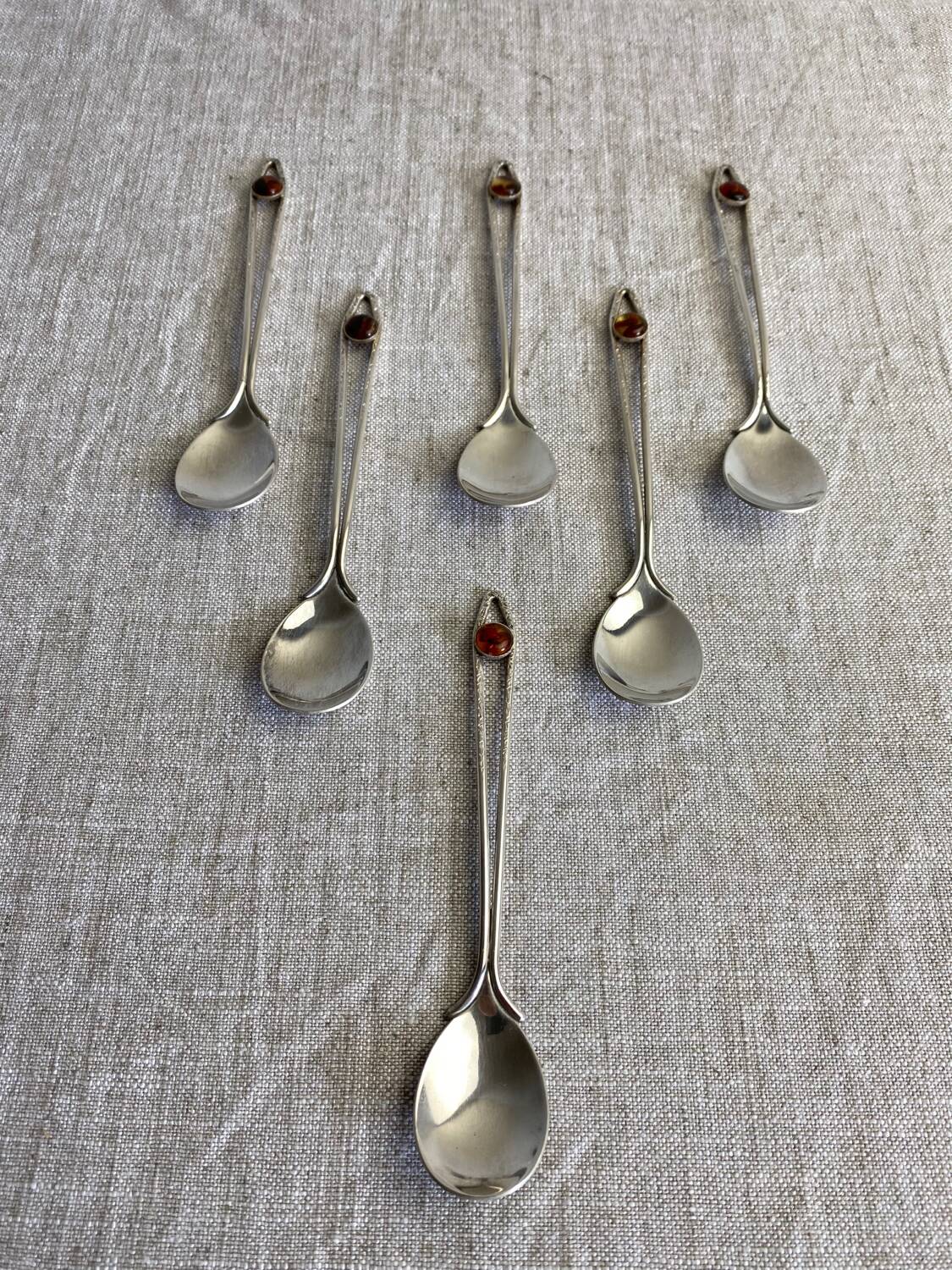 Art Nouveau metal and amber spoons
