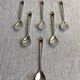 Art Nouveau metal and amber spoons