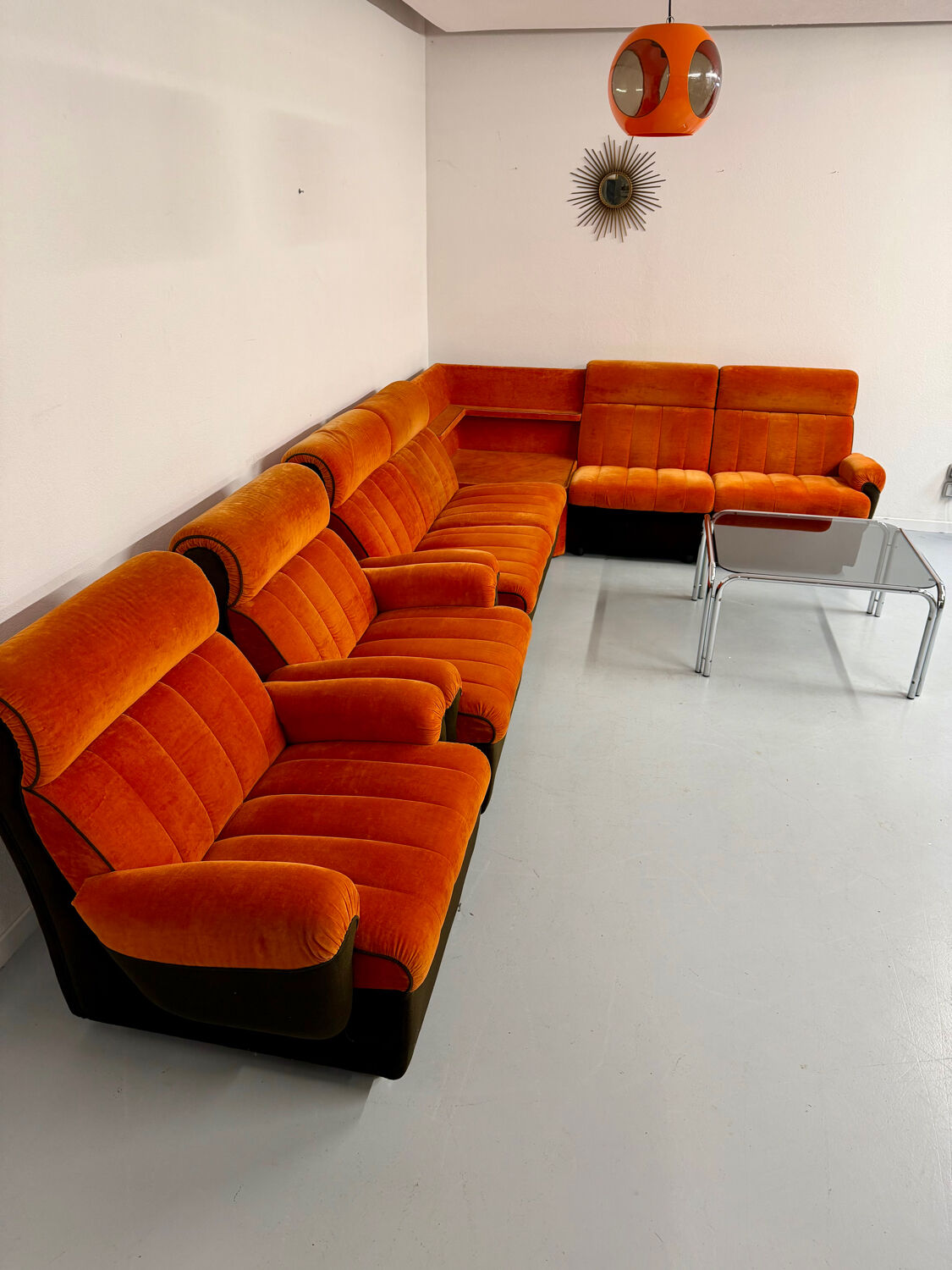 Modular vintage orange corner sofa, 1970s pop design.