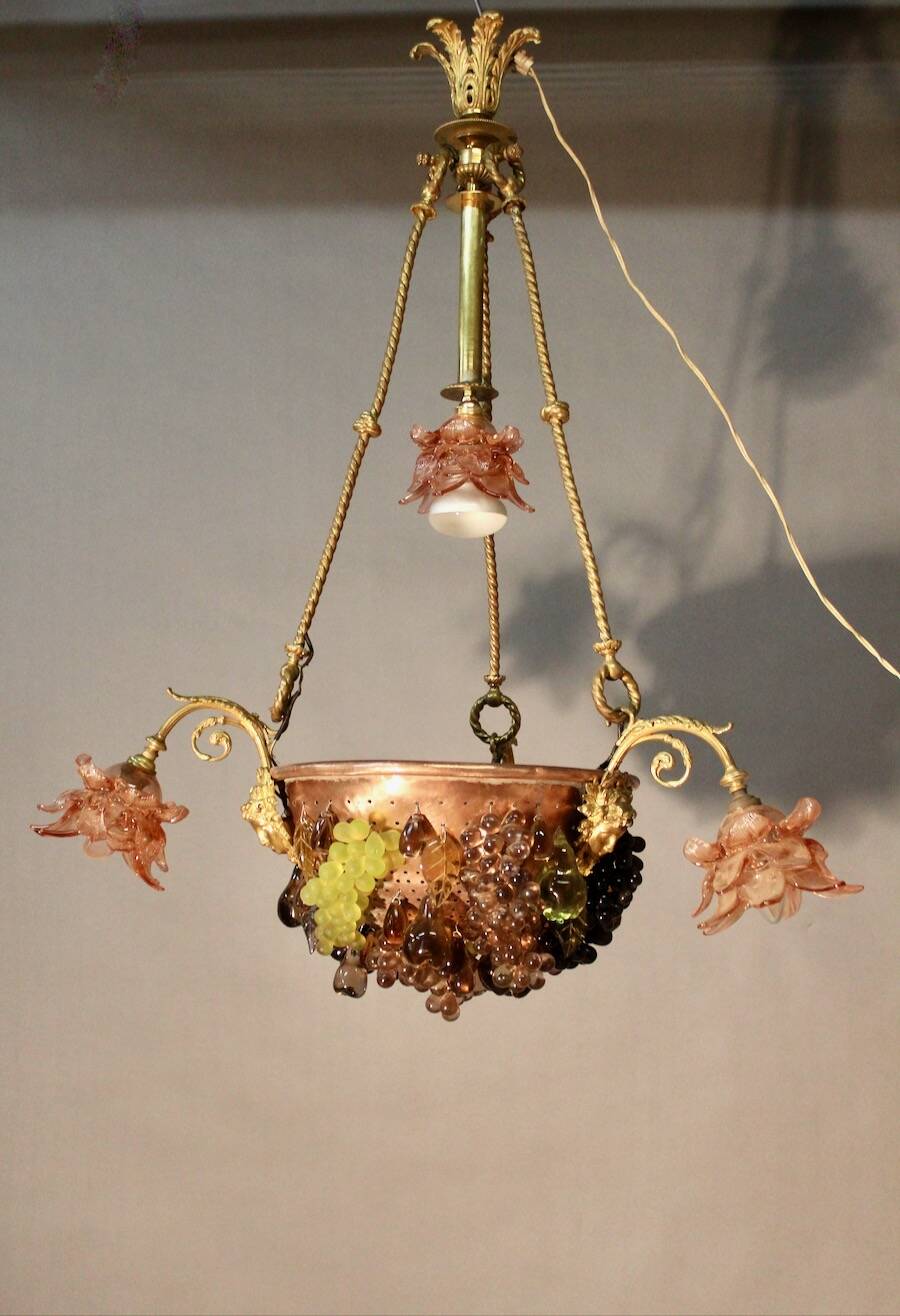 Bronze three-armed chandelier with a grape decoration.
