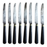 A set of 8 small knives with black wooden ferrules