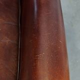 English style sheepskin leather wingback chair in a cognac color