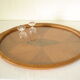 Oval wooden tray with glass and artisanal marquetry from the 70s.