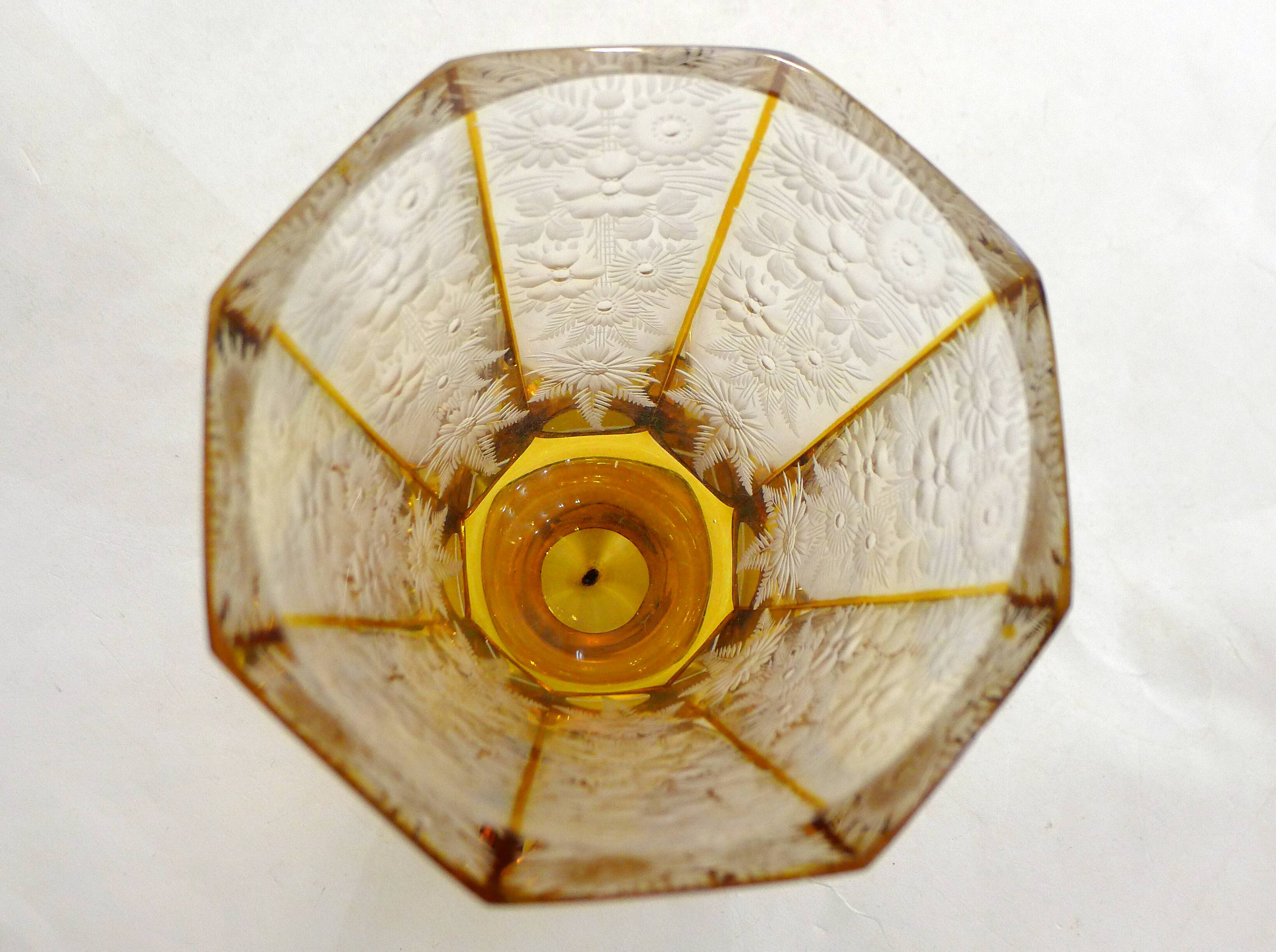 Art Deco vase engraved with flowers, faceted body on a pedestal.