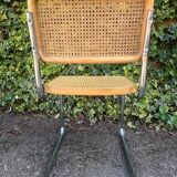 Wooden chair with caning in the style of Marcel Breuer.