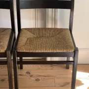 Pair of straw-seated wooden chairs in the regain style.