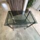 Serving dessert trolley with 2 smoked glass shelves and metal structure.