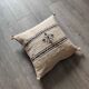 Off-white Berber cushion with wool pompom