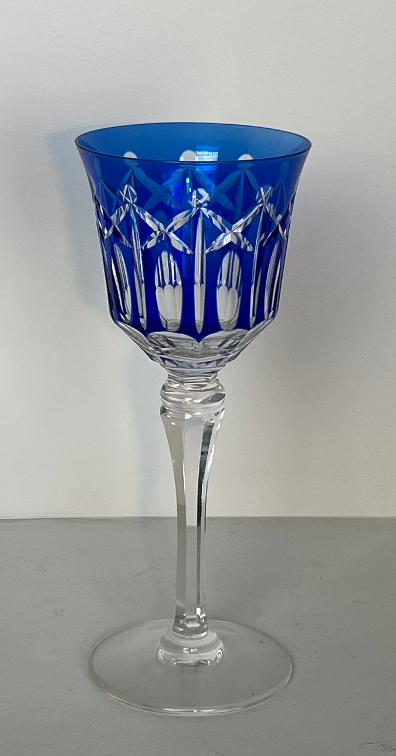 Set of twelve glasses in crystal tinted in different colours and cut with stars.