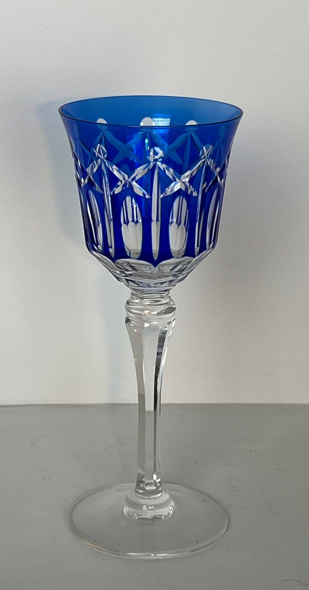 Set of twelve glasses in crystal tinted in different colours and cut with stars.