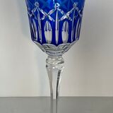 Set of twelve glasses in crystal tinted in different colours and cut with stars.