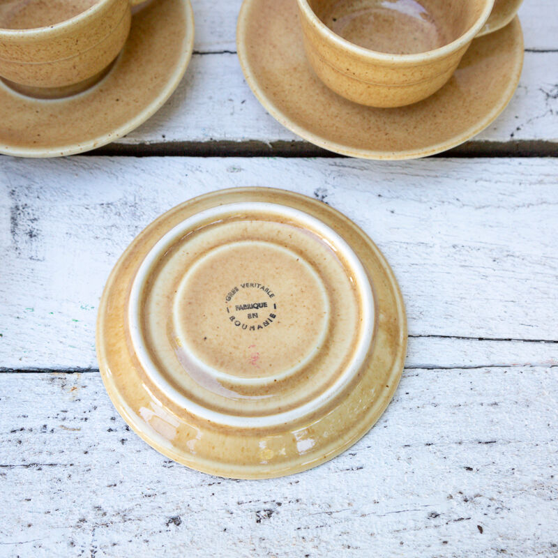 6 coffee cups and 6 sandstone saucers