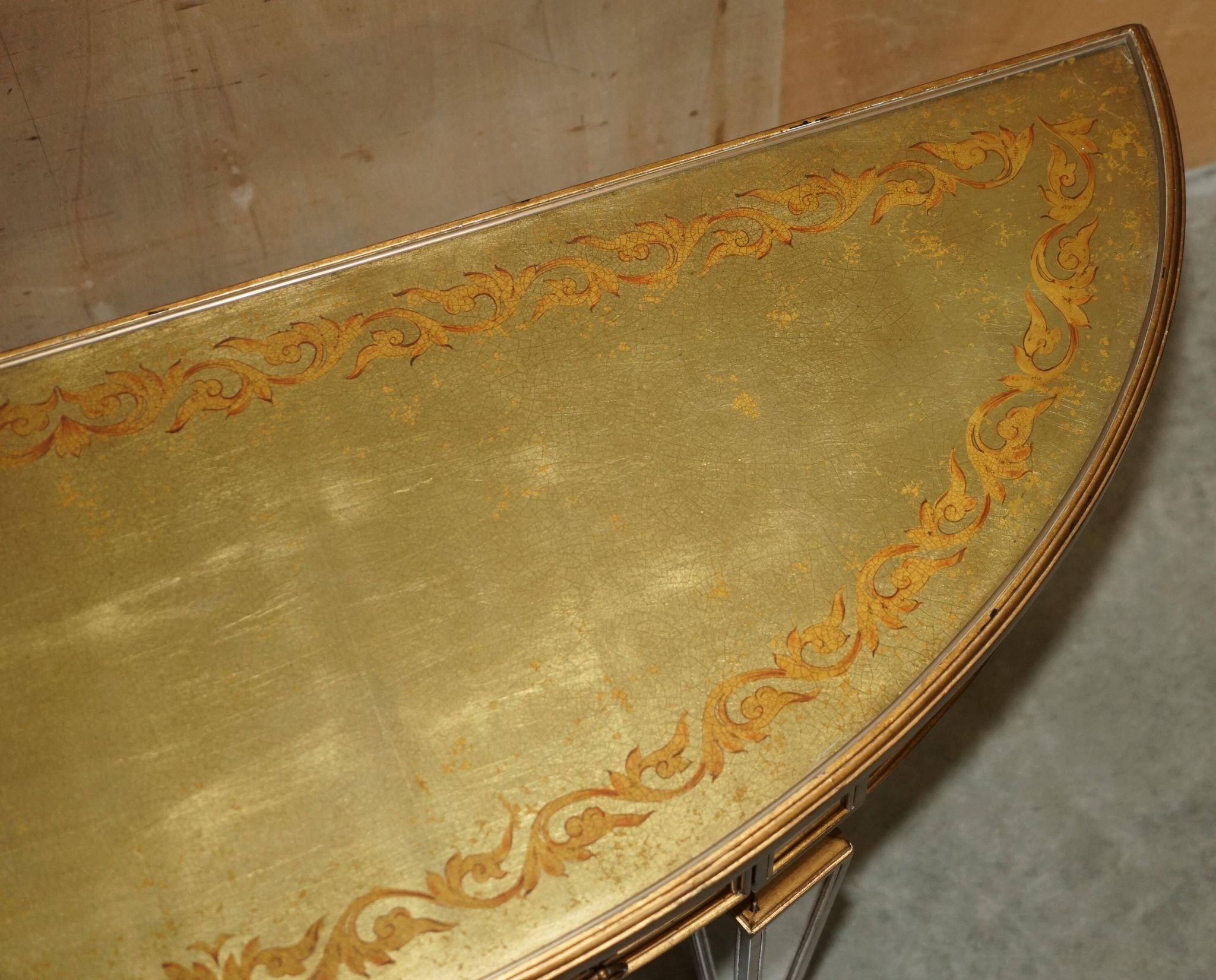 Half-moon console Eglomise Theodore Alexander with a gold finish.
