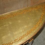 Half-moon console Eglomise Theodore Alexander with a gold finish.