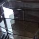 Nest of tables in glass and chrome steel.