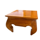 Small solid teak coffee table in opium style.