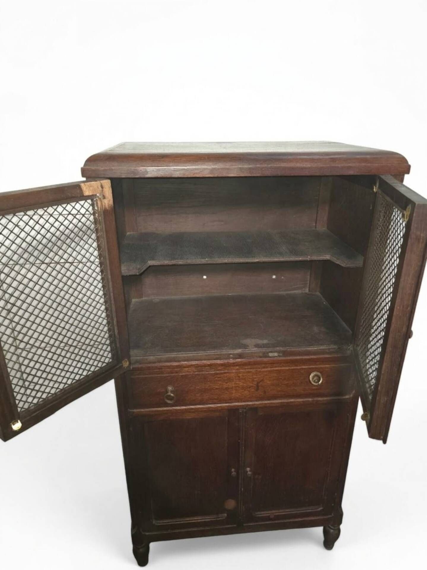 Vintage oak furniture with mesh doors.