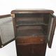 Vintage oak furniture with mesh doors.