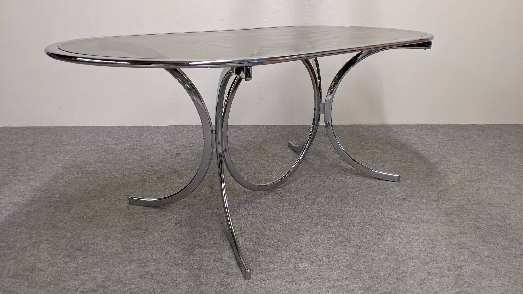 Oval dining table in chromed metal and smoked glass, Italy circa 1970