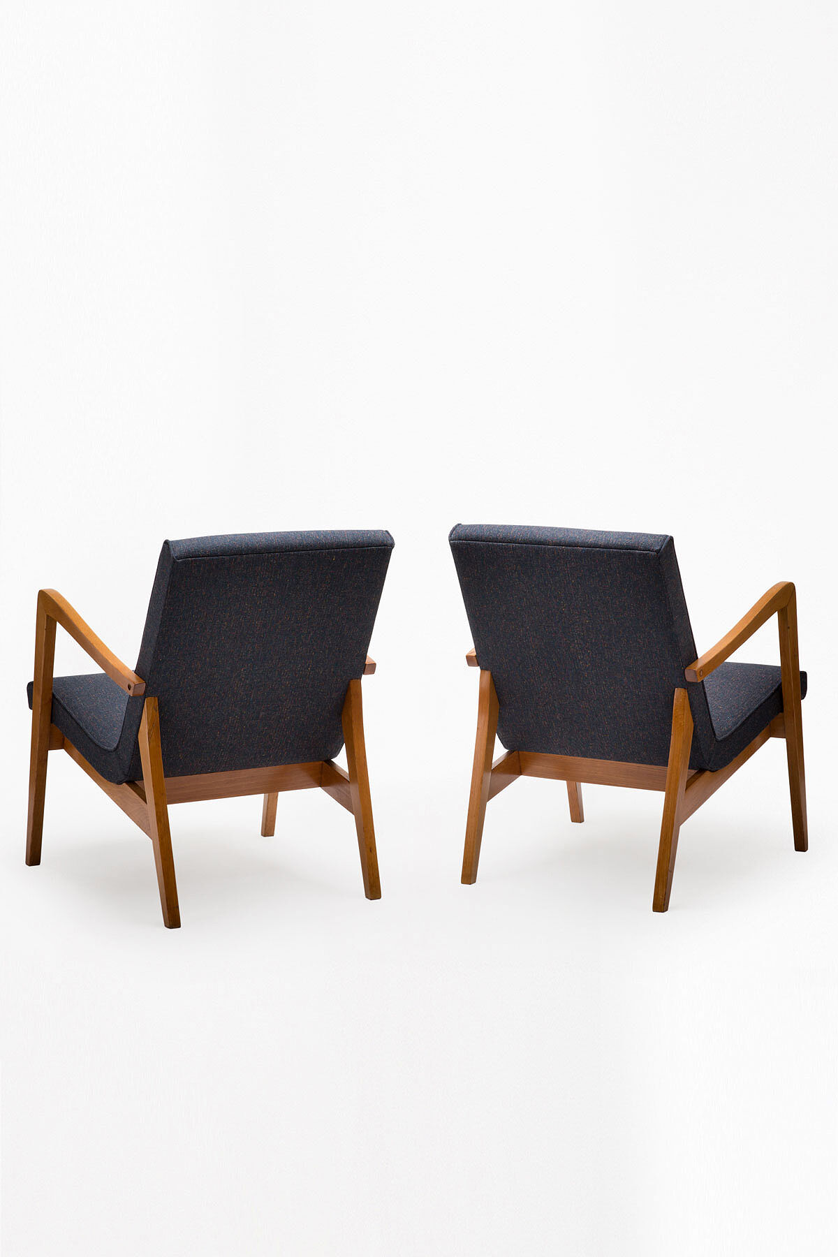 A pair of 300-138 armchairs from the 60s