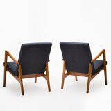 A pair of 300-138 armchairs from the 60s