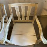 A pair of low armchairs
