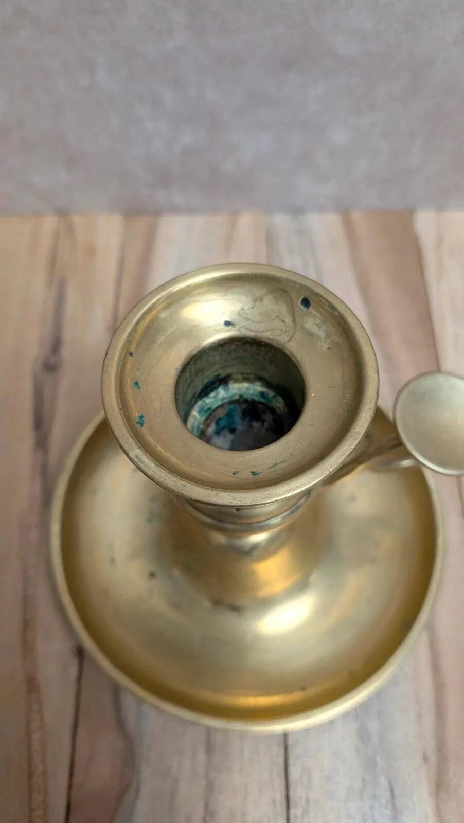 Antique brass candlestick with pusher