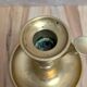Antique brass candlestick with pusher