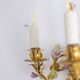 Pair of bronze wall lights with flower decoration. Circa 1880.