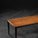 Classic vintage mid-century Scandinavian rosewood coffee table with a sliding black top.
