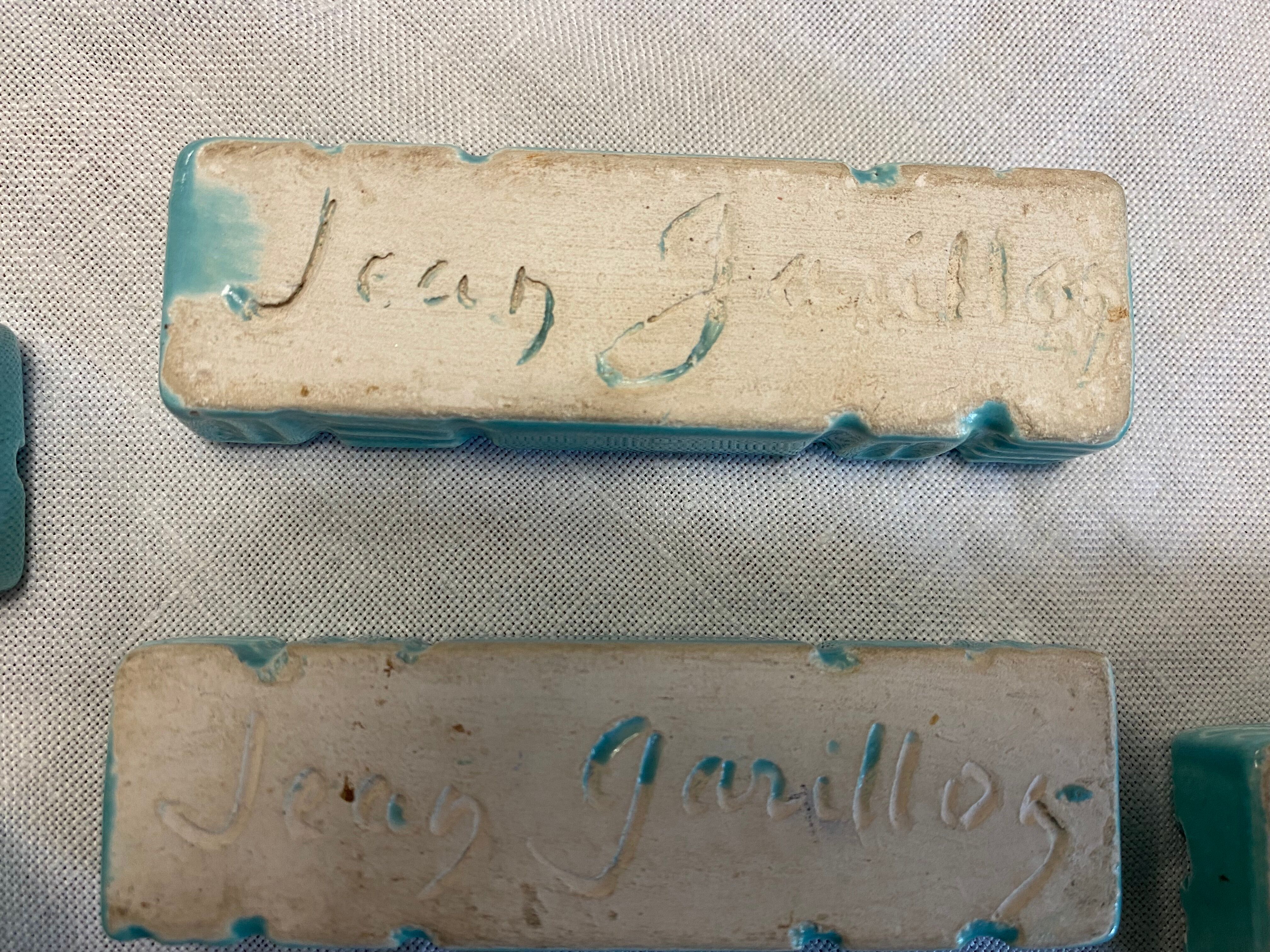 11 ceramic knife holders signed Jean Garillon