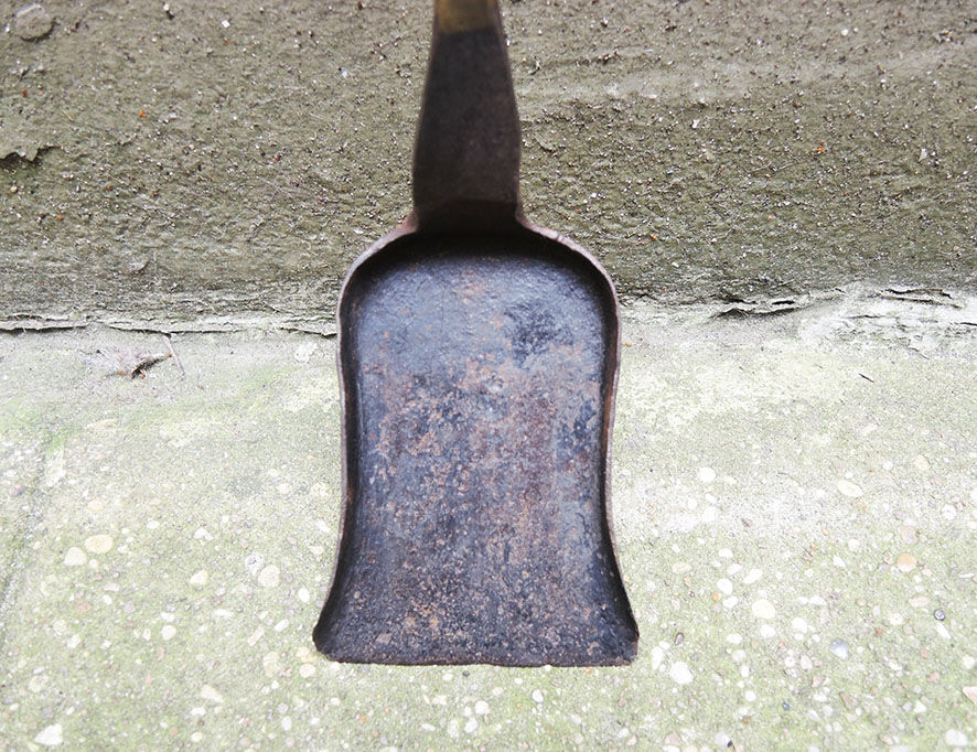 Old chimney shovel in wrought iron and brass