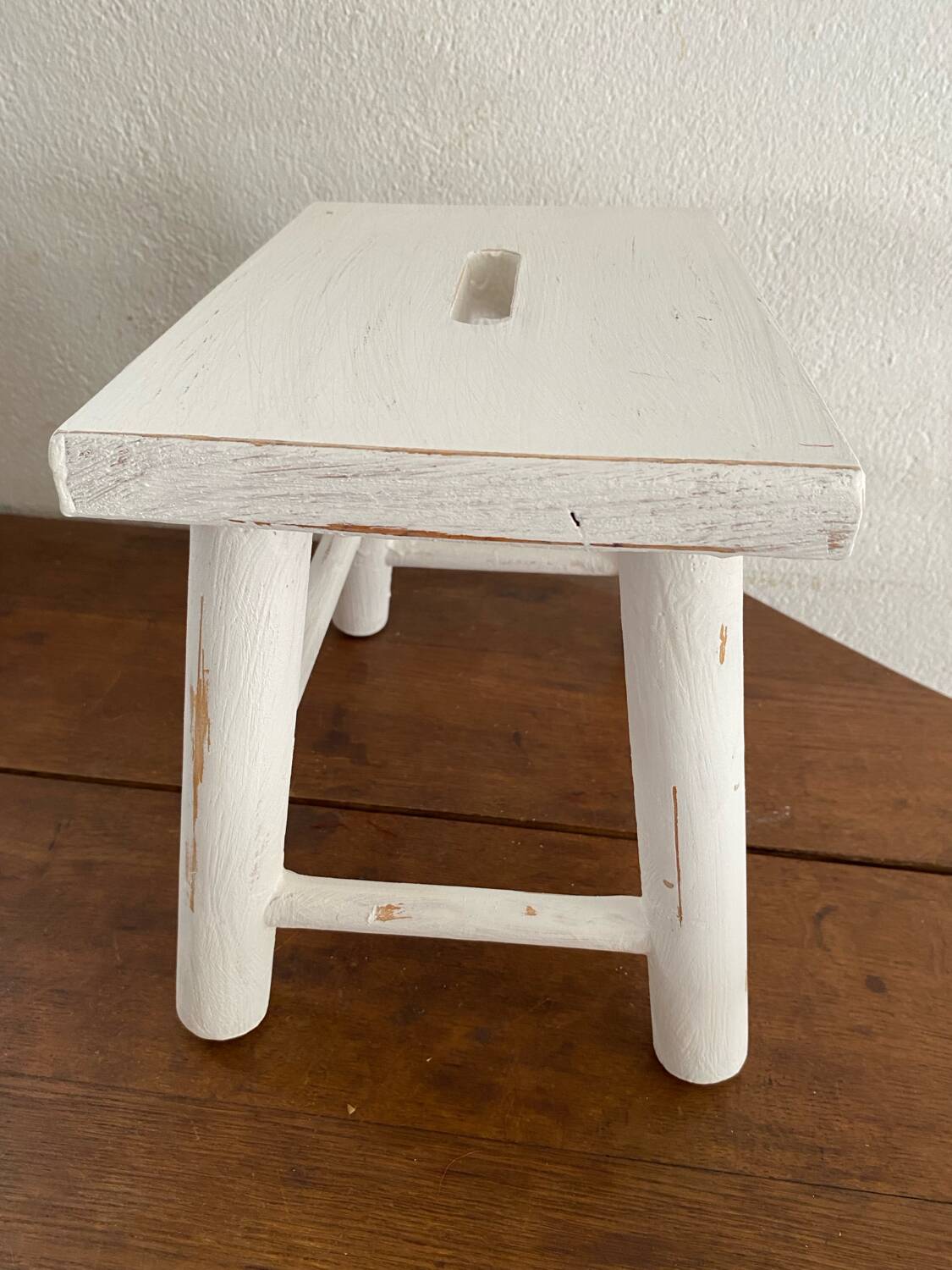 Small footrest bench in patinated white wood