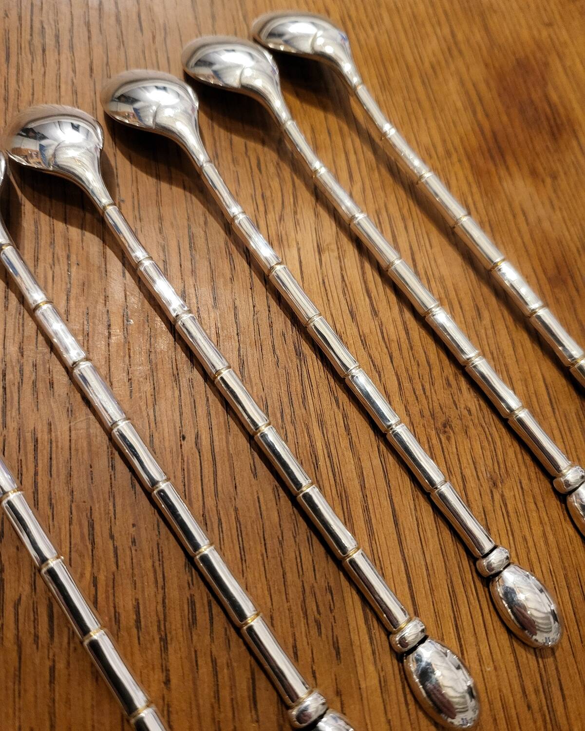 6 long silver-plated metal spoons