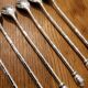 6 long silver-plated metal spoons