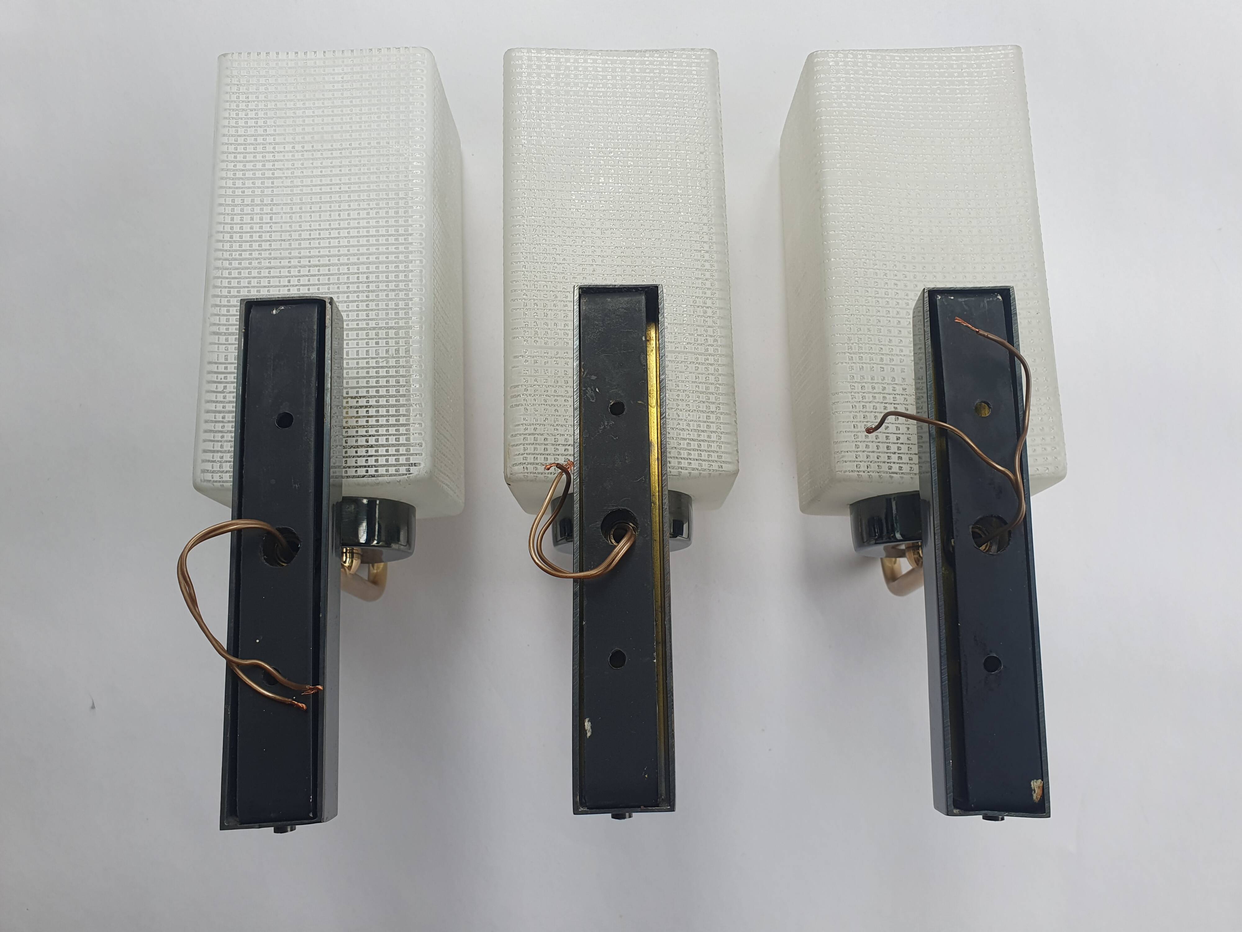 Three antique gold Arlus wall lights from the 50s