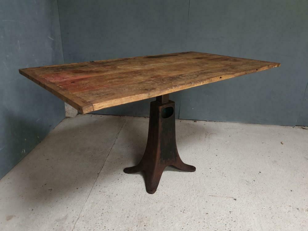 Old table on cast iron machine leg