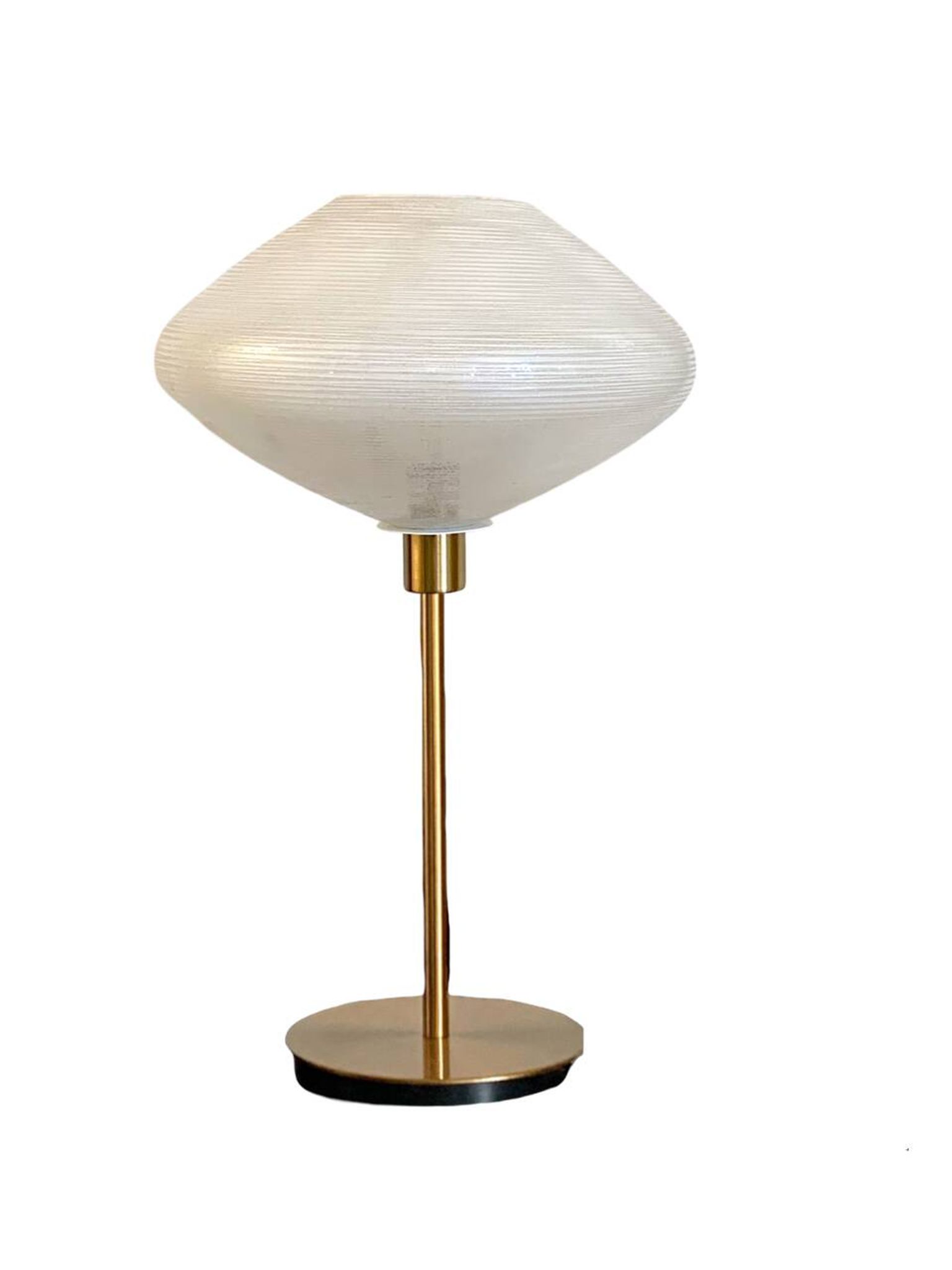 Table lamp with a vintage glass globe and saucer and a golden foot