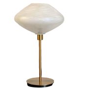 Table lamp with a vintage glass globe and saucer and a golden foot