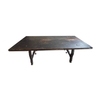 Solid wood table with ebony finish.
