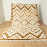 XXL Berber rug with long fringes from the 1960s. Cream-coloured pile with patterns in orange and green tones.