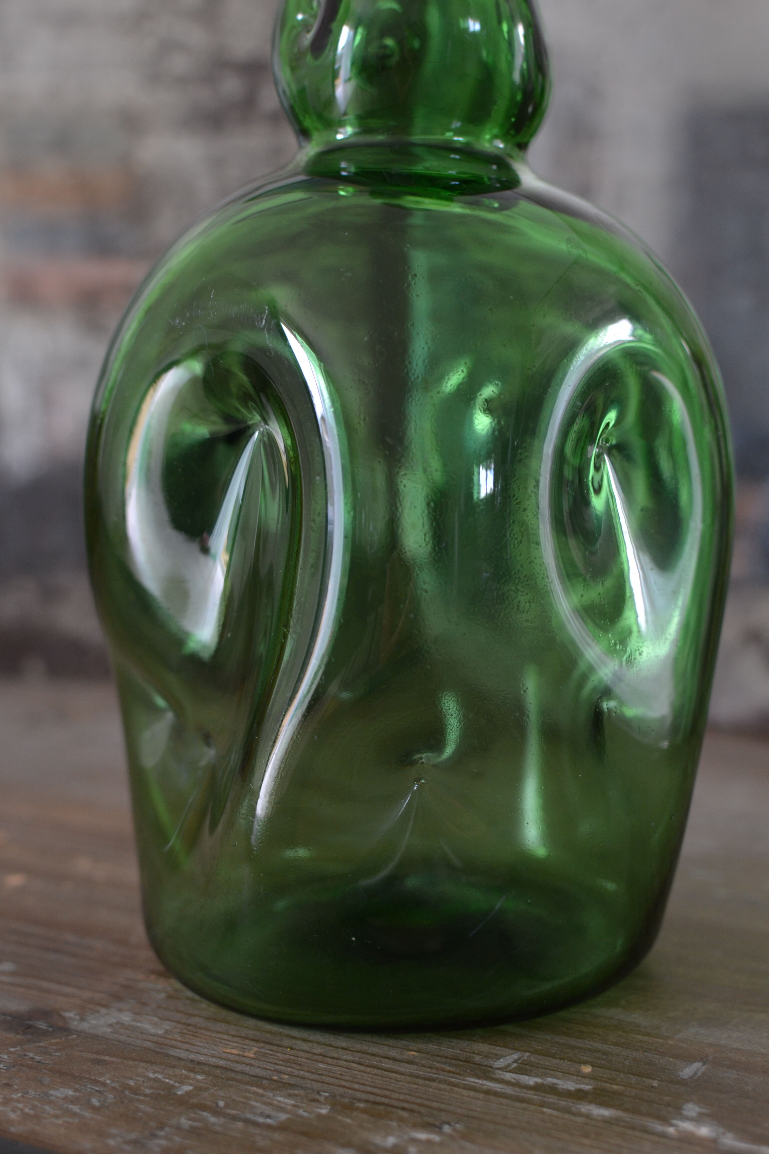 Dented green bottle