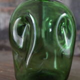 Dented green bottle