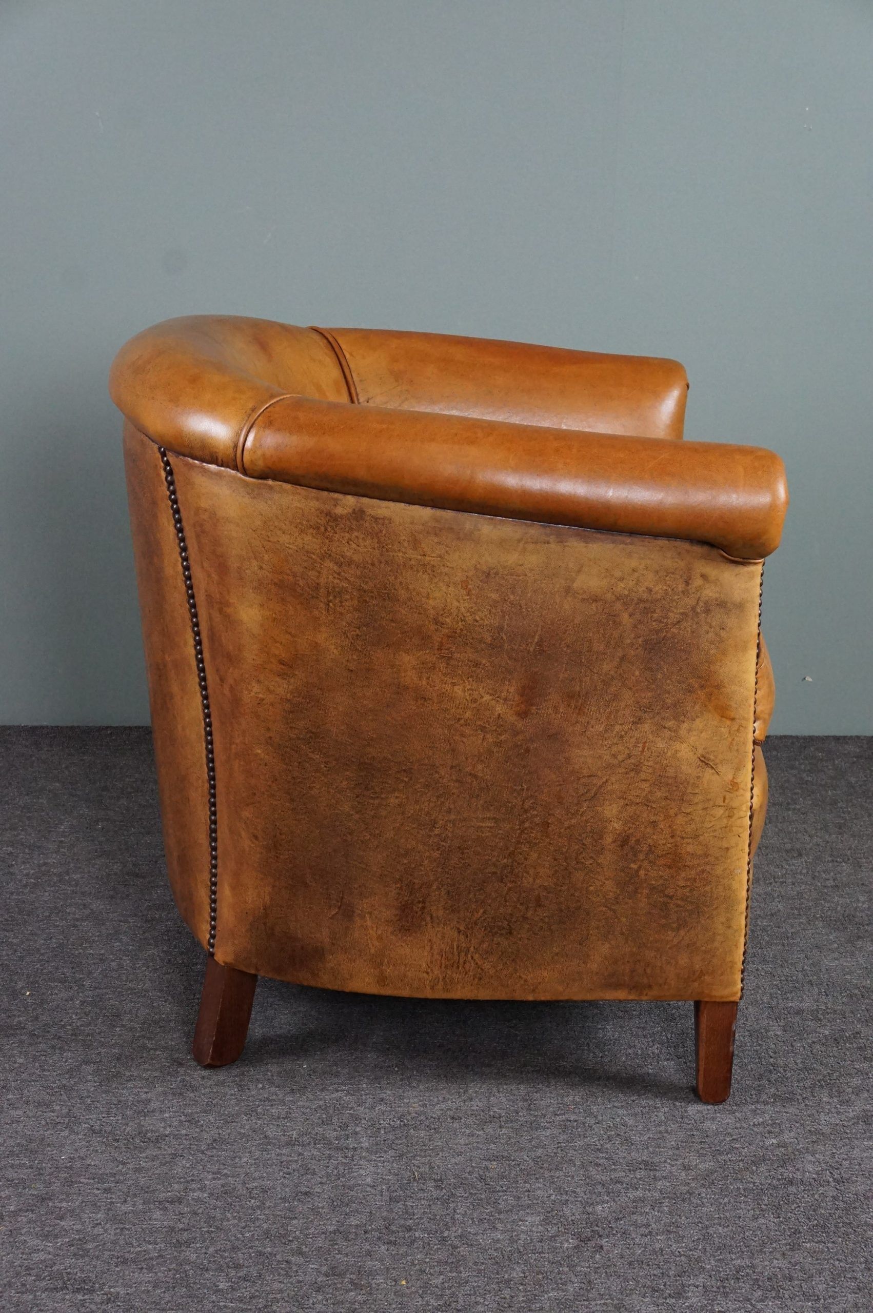 Club armchair in cognac-colored sheepskin