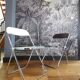 Duo of white and brown Piretti plia chairs
