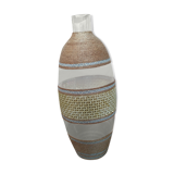 Cane glass-decorated vase and natural fibers
