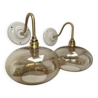Pair of gold swan neck wall lights