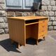 Double-sided desk with compass legs