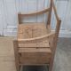 Antique armchair in raw wood