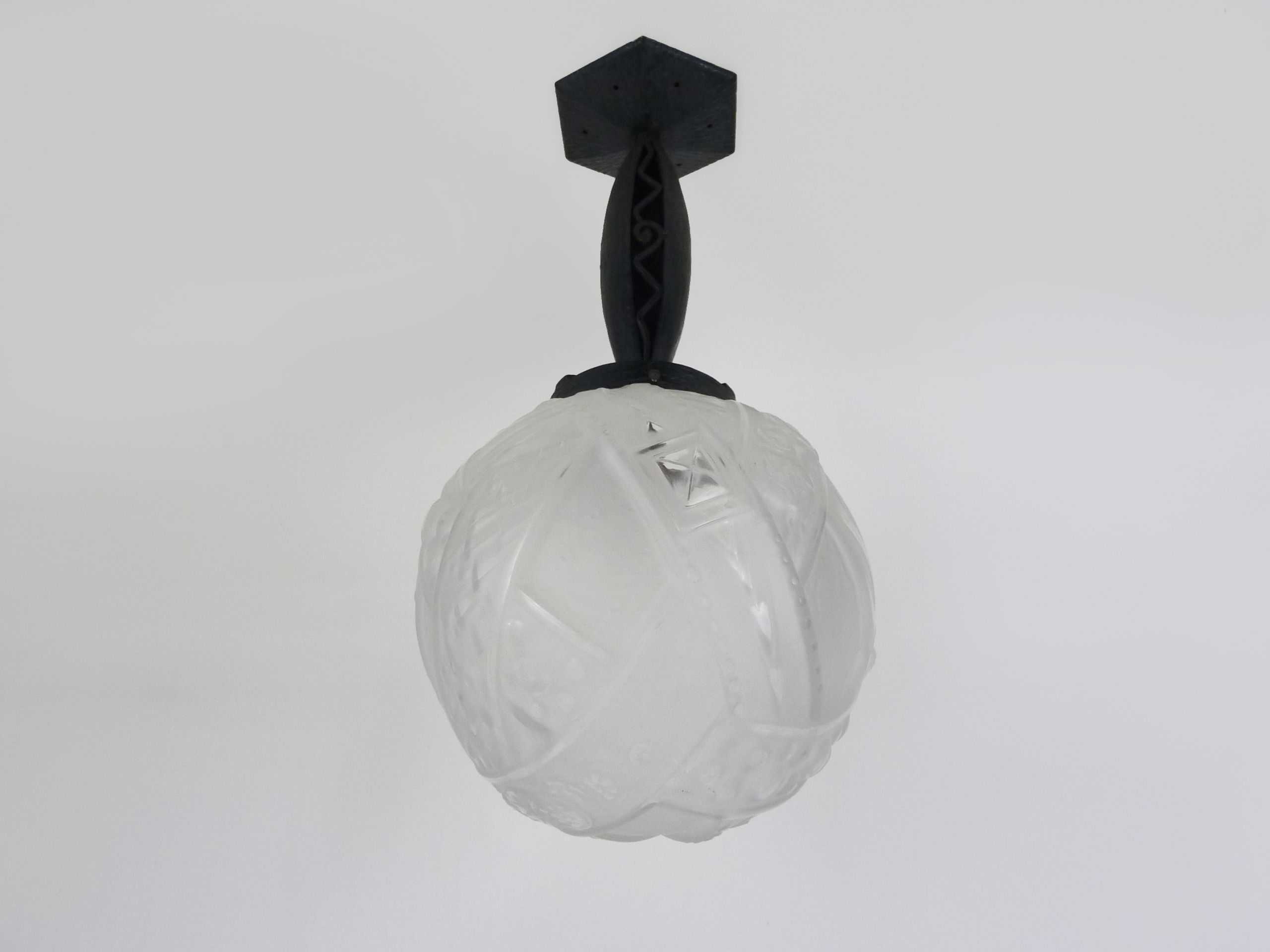 Art Deco hanging lamp in wrought iron Fournet and globe in glass paste